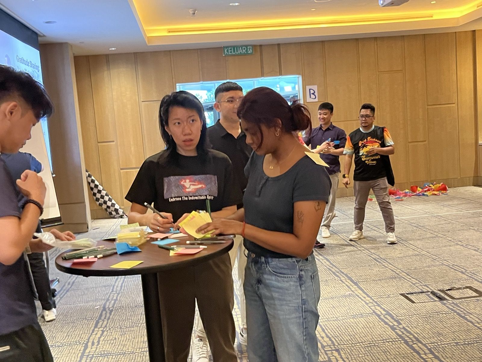 Participants sorting cards together during a DISC Assessment workshop