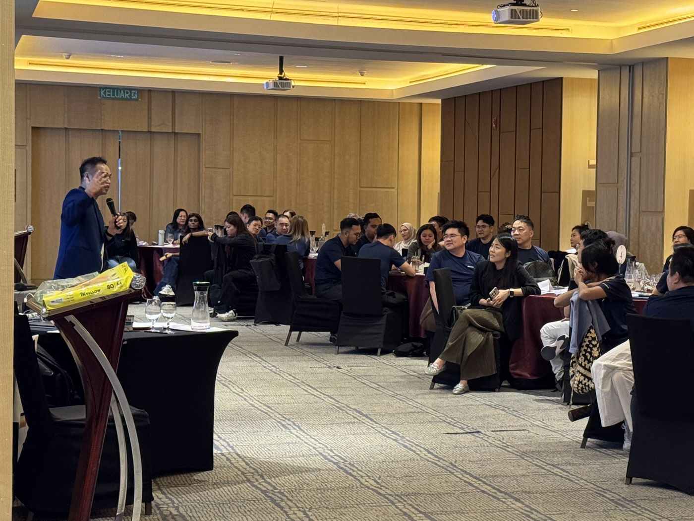 Edward Chan addressing a regional team at a leadership summit