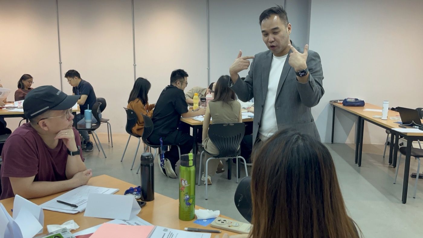 Edward Chan coaching participants during a leadership programme