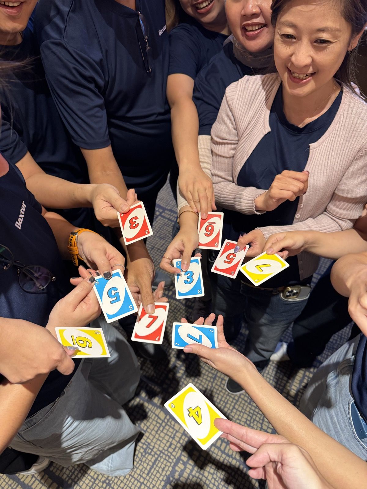 Close-up of hands playing a card game during training