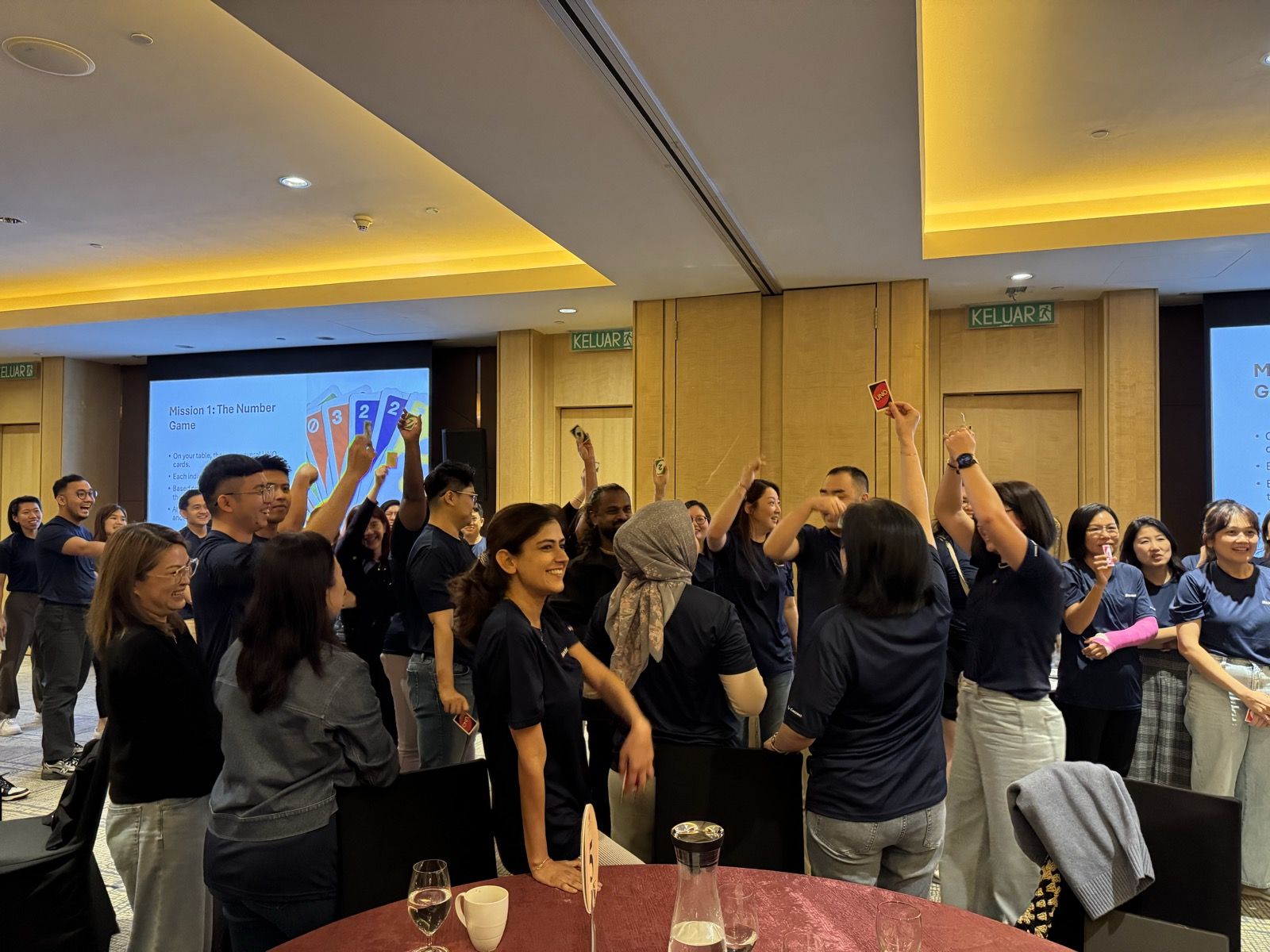A regional team raising cards during a game-based activity